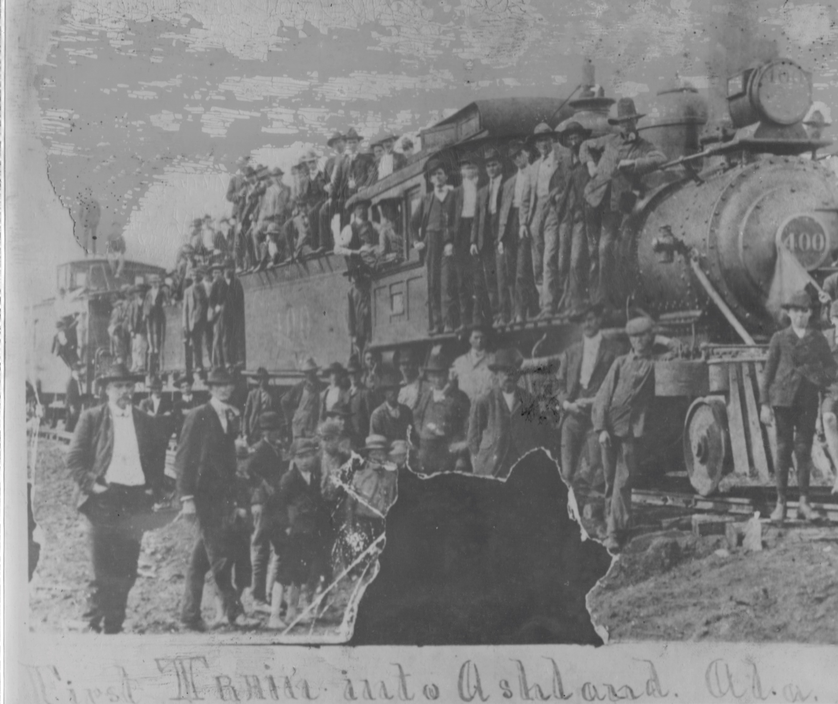 Train surrounded by passengers.